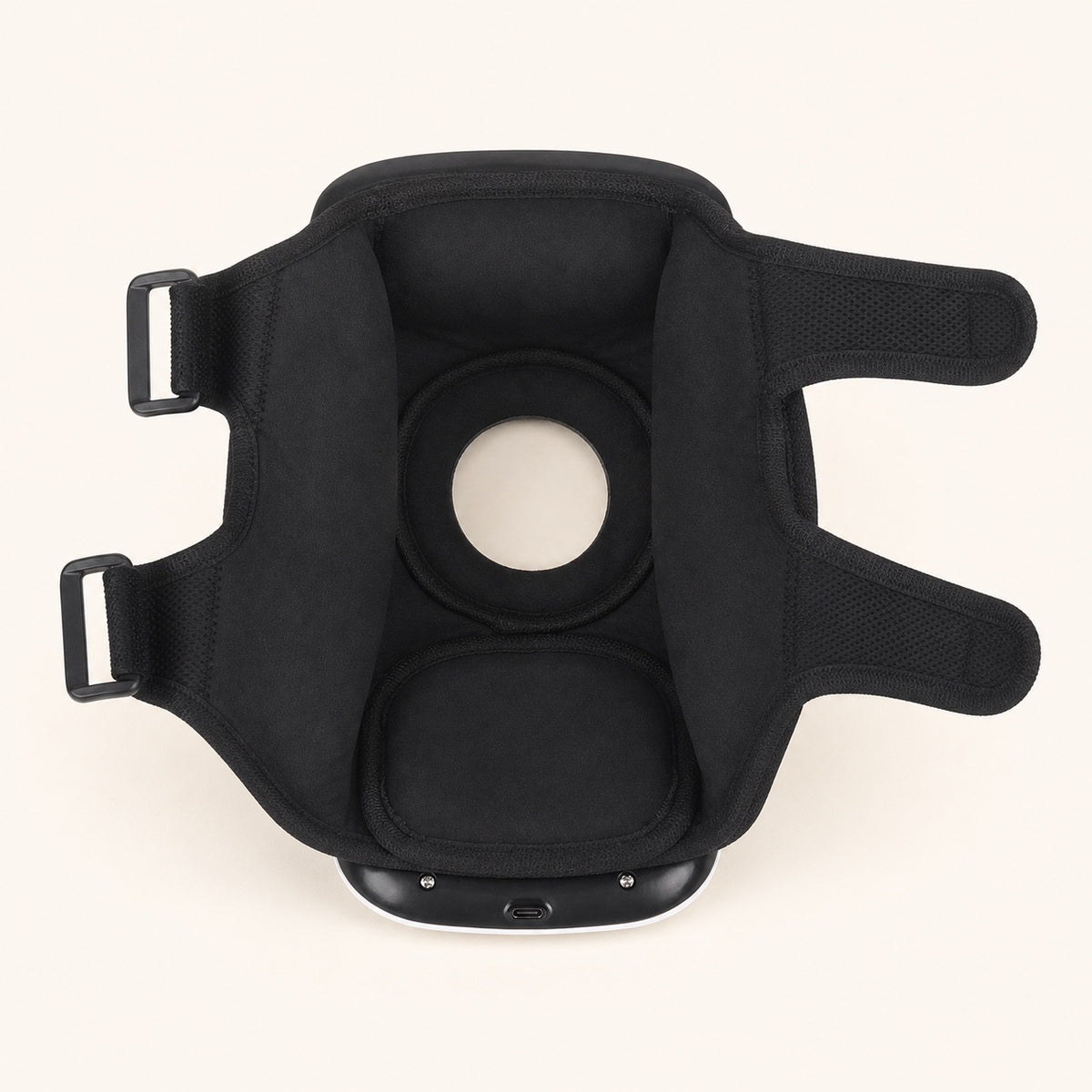 Interior padding and adjustable straps of the knee massager